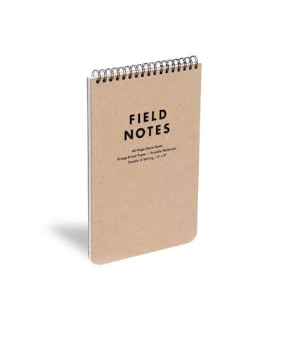 Front of the brown Steno Pad with top spiral binding shown at an angle.