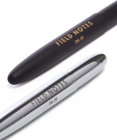 Close up of the black and silver chrome Field Notes Space Pens.
