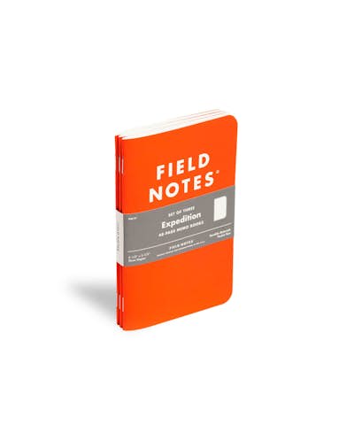 Expedition Edition waterproof notebook with orange cover at an angle.