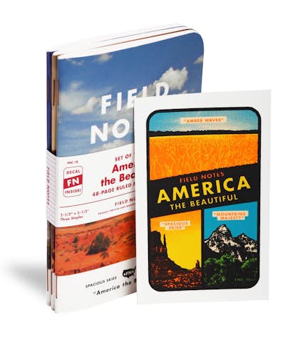 America the Beautiful limited edition at an angle with water transfer decal. The notebook cover is a desert scene.